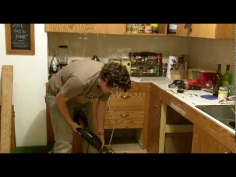 how to fasten dishwasher to cabinet