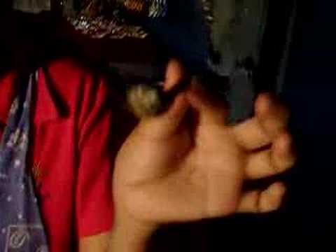 Woman eats scorpian and frog in Bangkok Thailand