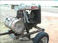 Ford Model \"A\" engine on trailer and 1989 Dodge Van
