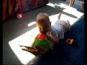 Zoe with a book age 7 months