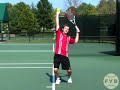 www.fuzzyyellowballs.com In this fourth step of the serve you get to something called the trophy pose. The trophy pose is the completion of your preparation -- from here, you are ready to swing and hit the tennis ball. The key to getting into the trophy pose is to time your lower and upper body preparation so that they finish at the same time. For more FREE video-based tennis lessons on how to serve... and other tennis instruction ... visit http