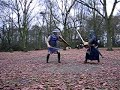 Knoxy and Kim sword fighting