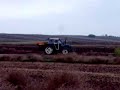 New Holland 7740 the fertilizer finished throwing and going