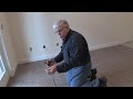 www.askthebuilder.com host Tim Carter demonstrates one method for keeping your grout lines straight when laying tile. In this project he is extending an existing tile floor and must maintain perfectly straight lines when laying floor tiles.