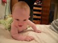 Laughing cute baby at bedtime