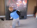 toddler on guitar hero in a battle
