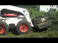 Up Close Bobcat Clearing Thick Brush on Hill; Chris Orser Landscaping