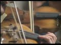 Gidon Kremer leads the English Chamber Orchestra in playing the second movement of the third concerto of Vivaldi's Four Seasons.1992.
