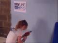DrylinePro - Sophie installs a shelf on a dot and dab wall.