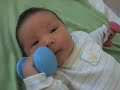 Infant playing with Baby Barbells