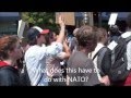 Anti-NATO Marchers Sing for the Collapse of Banks