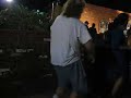 Guy dancing really badly at oudoor concert
