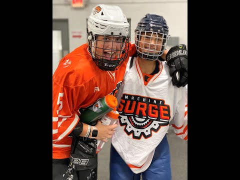 Helena Wisner Def No.10 White Jersey skating the puck out of the zone & attempted check by  Shattuck St Marys' player.