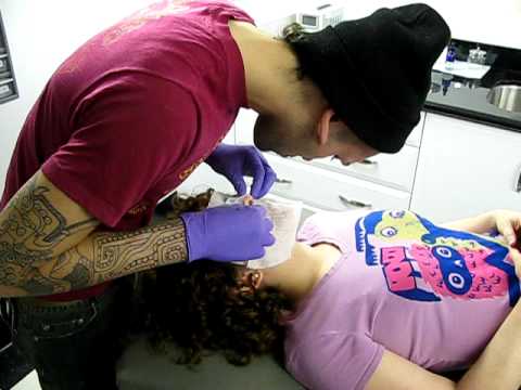 initial 12g septum piercing by Mateo at Top Tattoo and Body Piercing in 