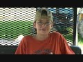 zack is on the tractor raking hay