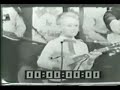 7-year old ricky skaggs performing foggy mountain special on martha white show backed by flatt and scruggs
