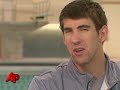 swimmer michael phelps' three-month suspension is over. in an interview with the associated press, the olympic gold medalist said he will swim in a meet next week in north carolina. (may 6)
