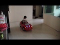 Samuel now can paddle the toy car on his own...