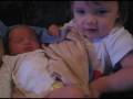 Madison plays with Hayes toes