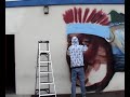 Aerosol Artist Caleb Aero spraying an Indian Face Aerosol Artist Caleb Aero spraying an Indian Face