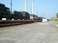 A BNSF GP28M, BNSF GP15-1 & a EMDX GP38-2 lead a fairly good sized military train thru the heart of downtown Pine Bluff, AR.  I almost didnt make it as I had to turn around and fight traffic and red lights to get ahead of this train.