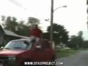Idiot Driving---riding? his truck
