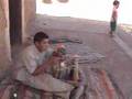 2005.10.12-Kid Prepping Trilobite-Alnif, Morocco