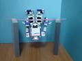 i-SOBOT　practices the horizontal bar.