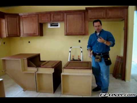 how to fasten island cabinets to floor