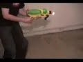 guy makes a flame thrower using water gun. Nice invention :)