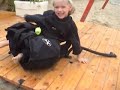 Sonya, 4 y.o., wearing a wet suit, mask and BC. She's having fun at the beach before departing with her family to the sea for aquaskipping. Thanks to Krystio from scubadiving-bg.com!