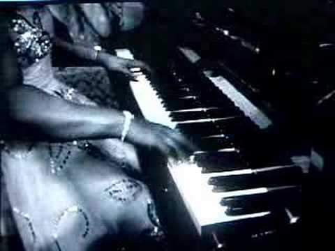 Winifried - This is of Winifred' own compositions and here she is playing it in London, 1953.