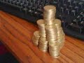 loads of my money in pounds lol 100 pound in pound coins stacked up in a pyramis with the simpsons whats a muppet to it