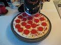 cooking my first pizza on my pizzazz. it was a tombstone pepperoni pizza. i shouldve left it on a little longer. but, ill do better the next time