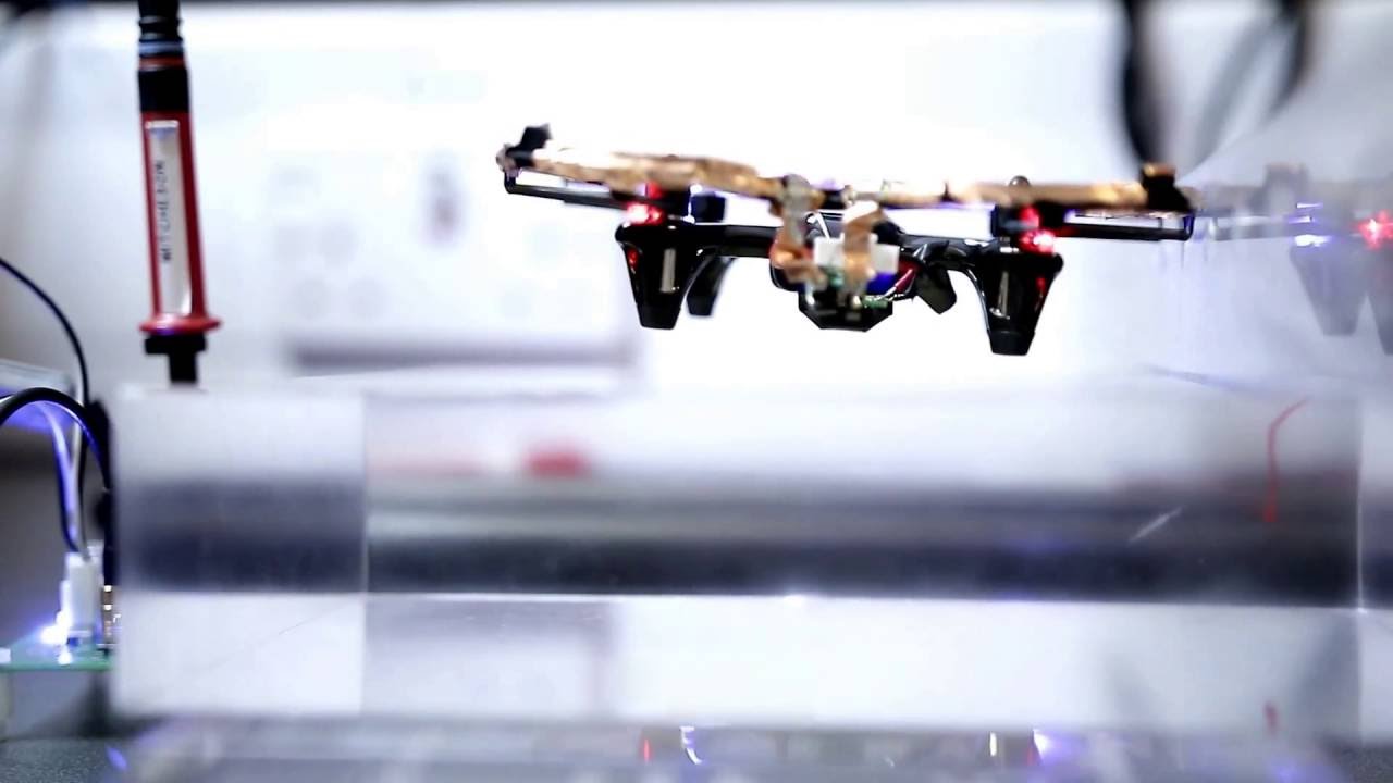 Transferring power wirelessly to a battery-less quadrotor drone