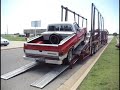 Driver Loads Vehicle onto Trailer