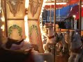 Zac and Nick ride the merry-go-round