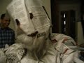 kenny recieving his final newspaper as mr. roboto