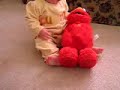 Baby attacking Elmo