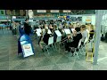the brass band of vantaa musiikkiopisto (the vantaa conservatoire of music), vamos and lumo, played theme from james bond at helsinki airport departures hall...