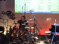 it's playing my song g-strings, a very funky rock song. it was a drum clinic and we used 48 microphones for live presentation
