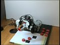 Bioloid robotic arm playing tic-tac-toe