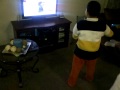 raymond playing nintendo wiii the smurfs game this is angel big brother funny!!!!