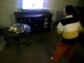 raymond playing nintendo wiii the smurfs game this is angel big brother funny!!!!