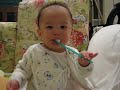Baby Timothy brush his own teeth