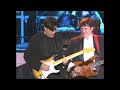 Eric Clapton joins members of the Band in a moving performance of 