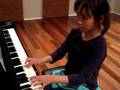 Alcia playing piano