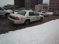 Taxi Driver Spinning Wheels in Seattle Ice/Snow