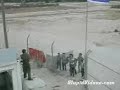 Israeli Solder Entertains Kids at Border