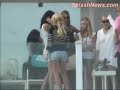 here are some new bikini candids of lindsay lohan on the 4th of july. in some of the pictures she looks like she has a bit of a belly -- and it looks like she's enjoying a nice water cocktail. either way, i bet she's way more fun drunk and fat.